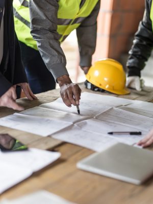 Housing projects - blueprint - finger pointing